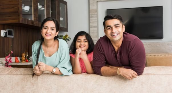 portrait-happy-indian-asian-young-family-while-sitting-sofa-lying-floor-sitting-against-wall_466689-7308-transformed