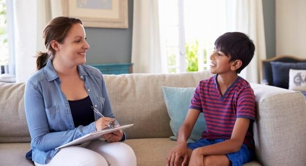young-boy-talking-with-counselor-home_1339860-2843-transformed